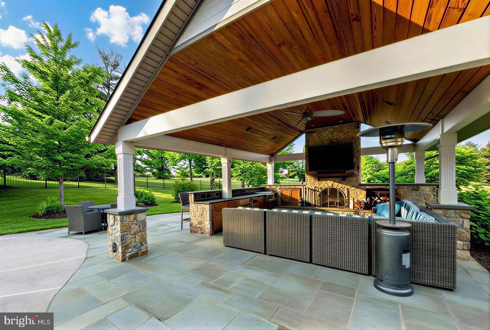 3165 Doe Brook Road Collegeville, PA 19426 - Photo 4 of 5 a view of a patio with table and chairs potted plants with palm trees
