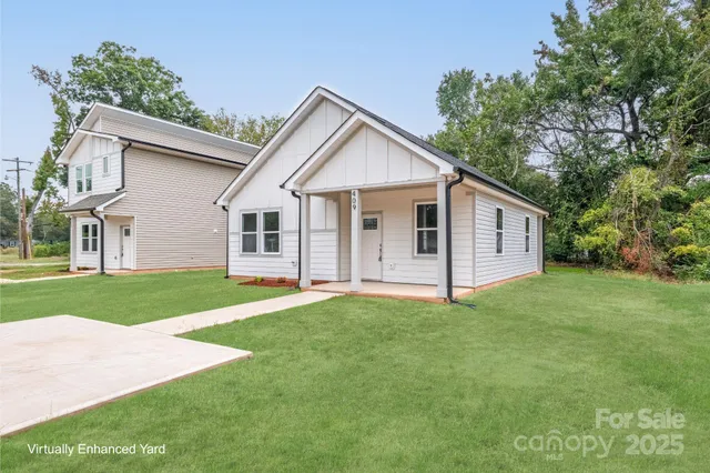 a view of a yard in front of a house with green space