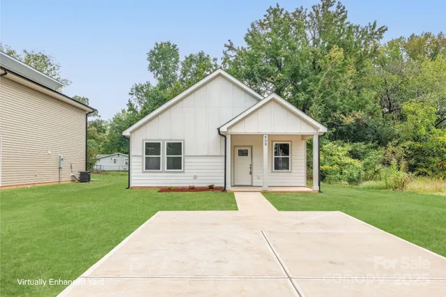 a front view of house with yard and green space