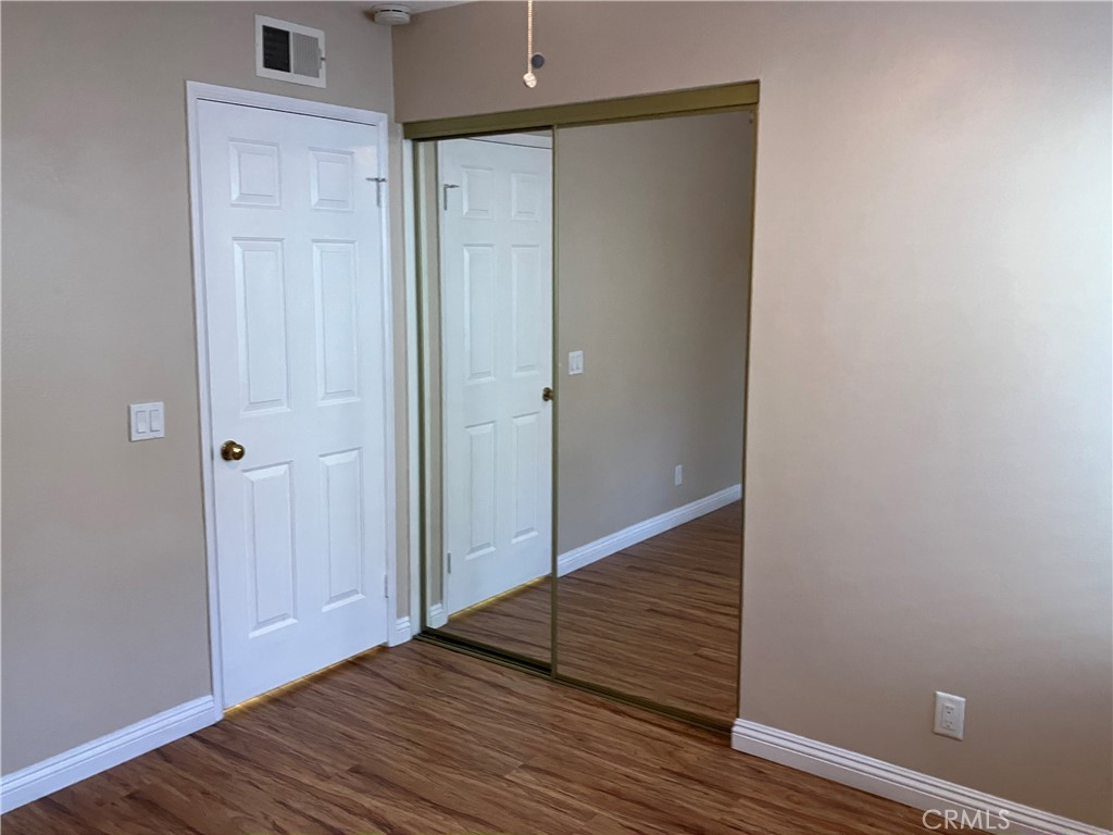 19933 Ralph Street Walnut, CA 91789 - Photo 51 of 77 a view of an empty room with wooden floor