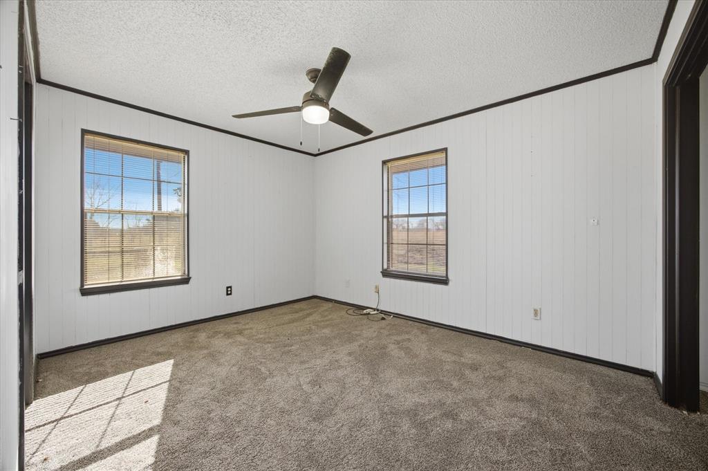 13409 County Road 349 Terrell, TX 75161 - Photo 14 of 27 an empty room with windows and fan