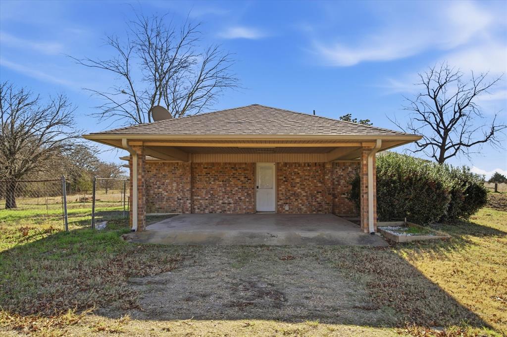 13409 County Road 349 Terrell, TX 75161 - Photo 24 of 27 a view of a house with a yard and large tree