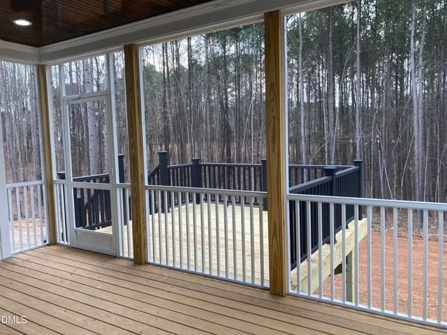 a view of a balcony with floor to ceiling window