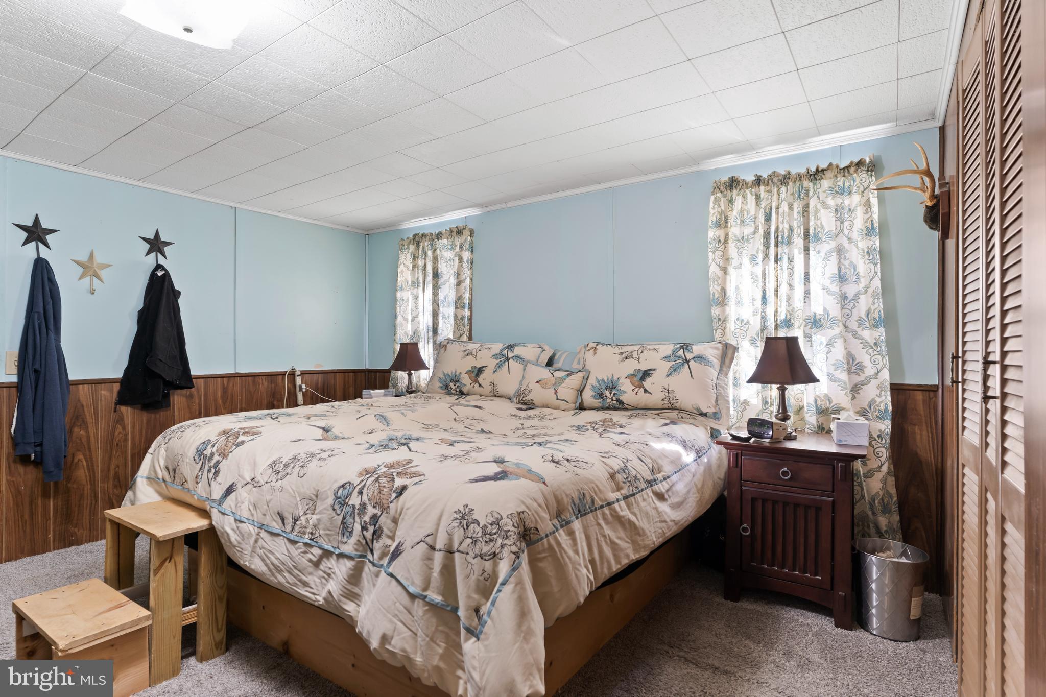 295 Greenbriar Road Elliottsburg, PA 17024 - Photo 14 of 25 a bed sitting in a bedroom next to a window