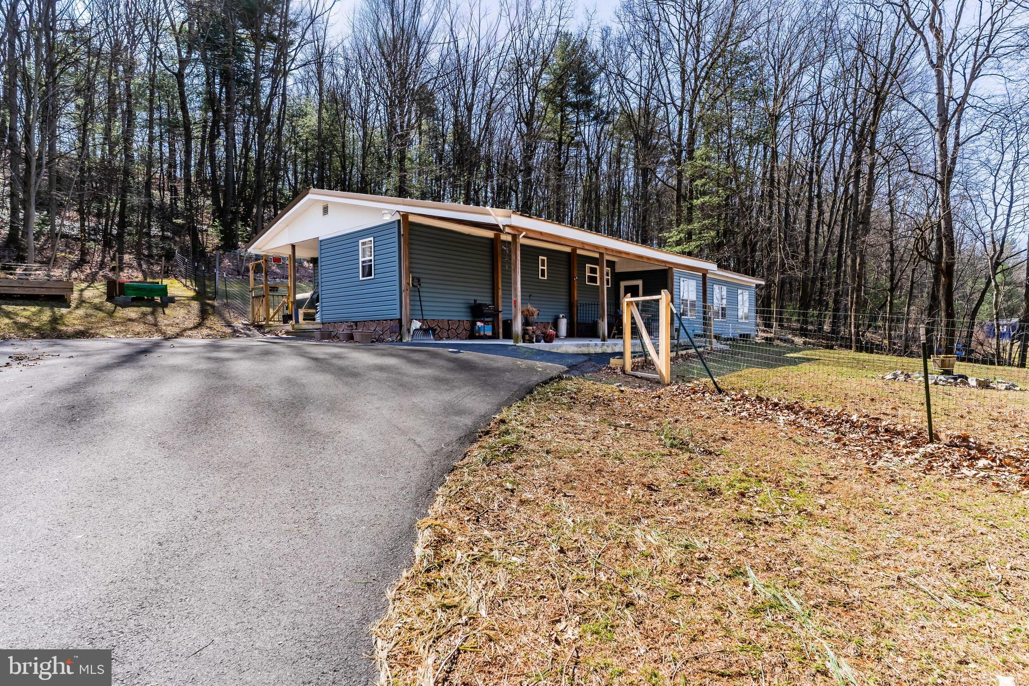 295 Greenbriar Road Elliottsburg, PA 17024 - Photo 19 of 25 a view of a large house with a large space and large trees