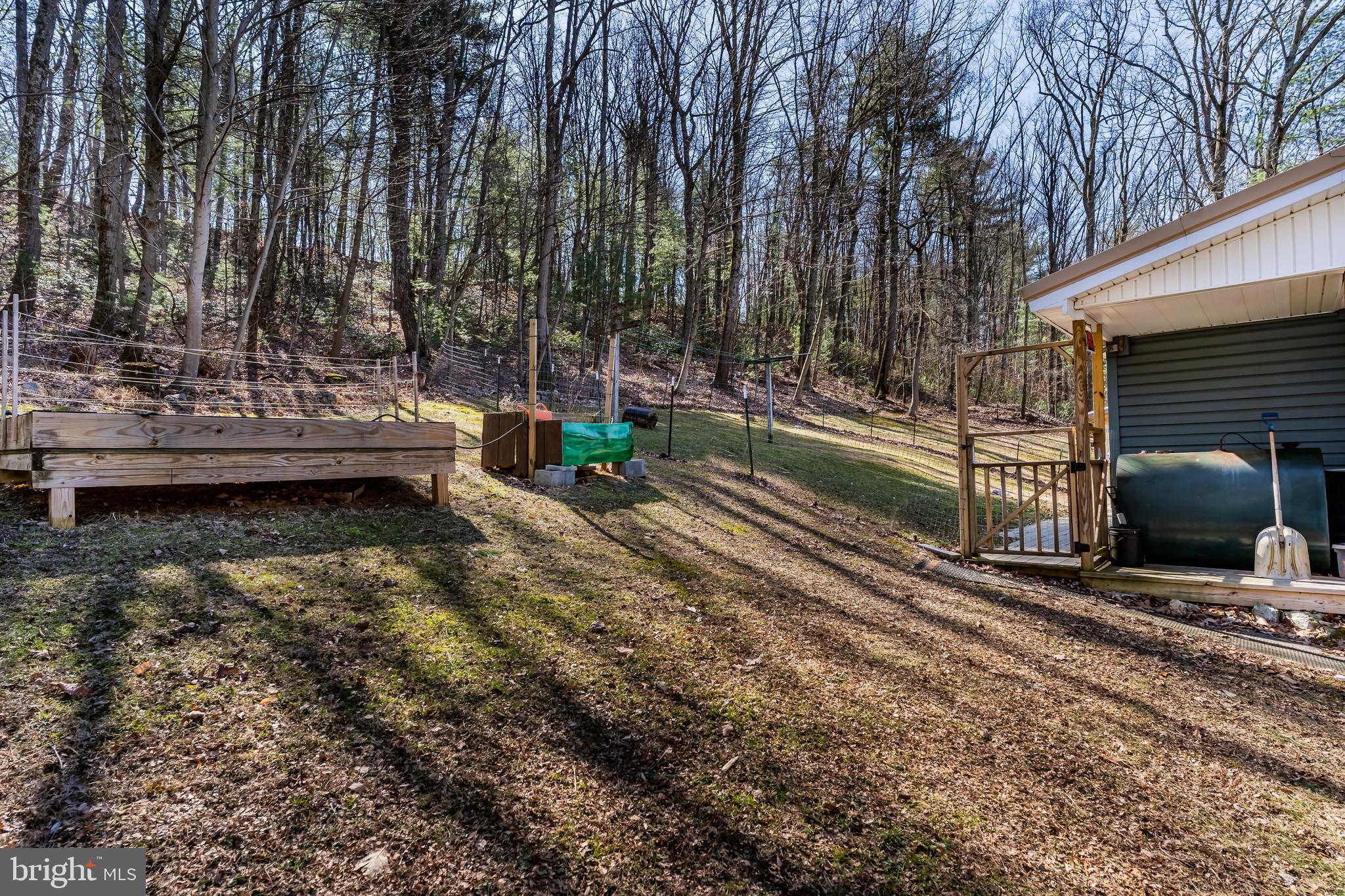 295 Greenbriar Road Elliottsburg, PA 17024 - Photo 24 of 25 a view of a backyard with swimming pool and sitting area