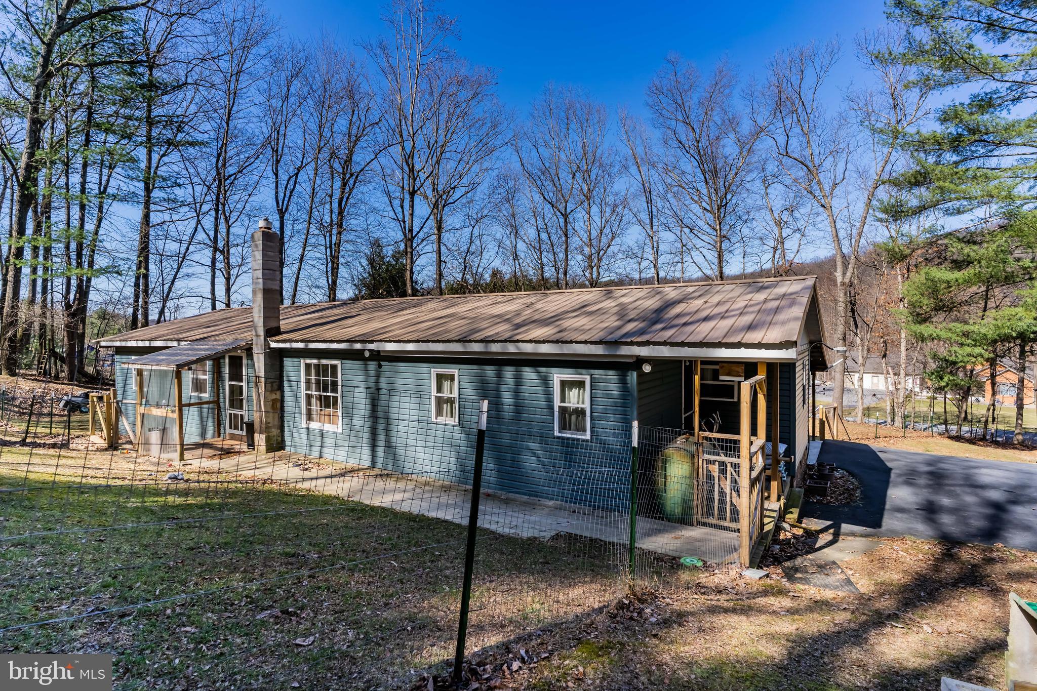 295 Greenbriar Road Elliottsburg, PA 17024 - Photo 25 of 25 a view of a house with backyard tub and trees