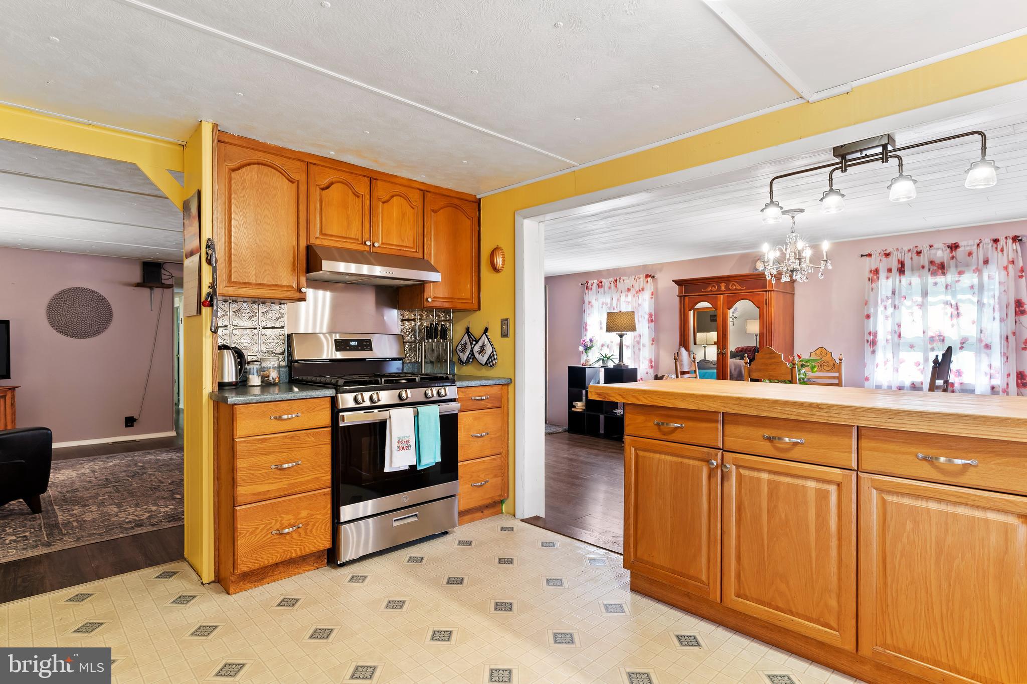 295 Greenbriar Road Elliottsburg, PA 17024 - Photo 3 of 25 a kitchen with stainless steel appliances granite countertop a stove a sink and a refrigerator