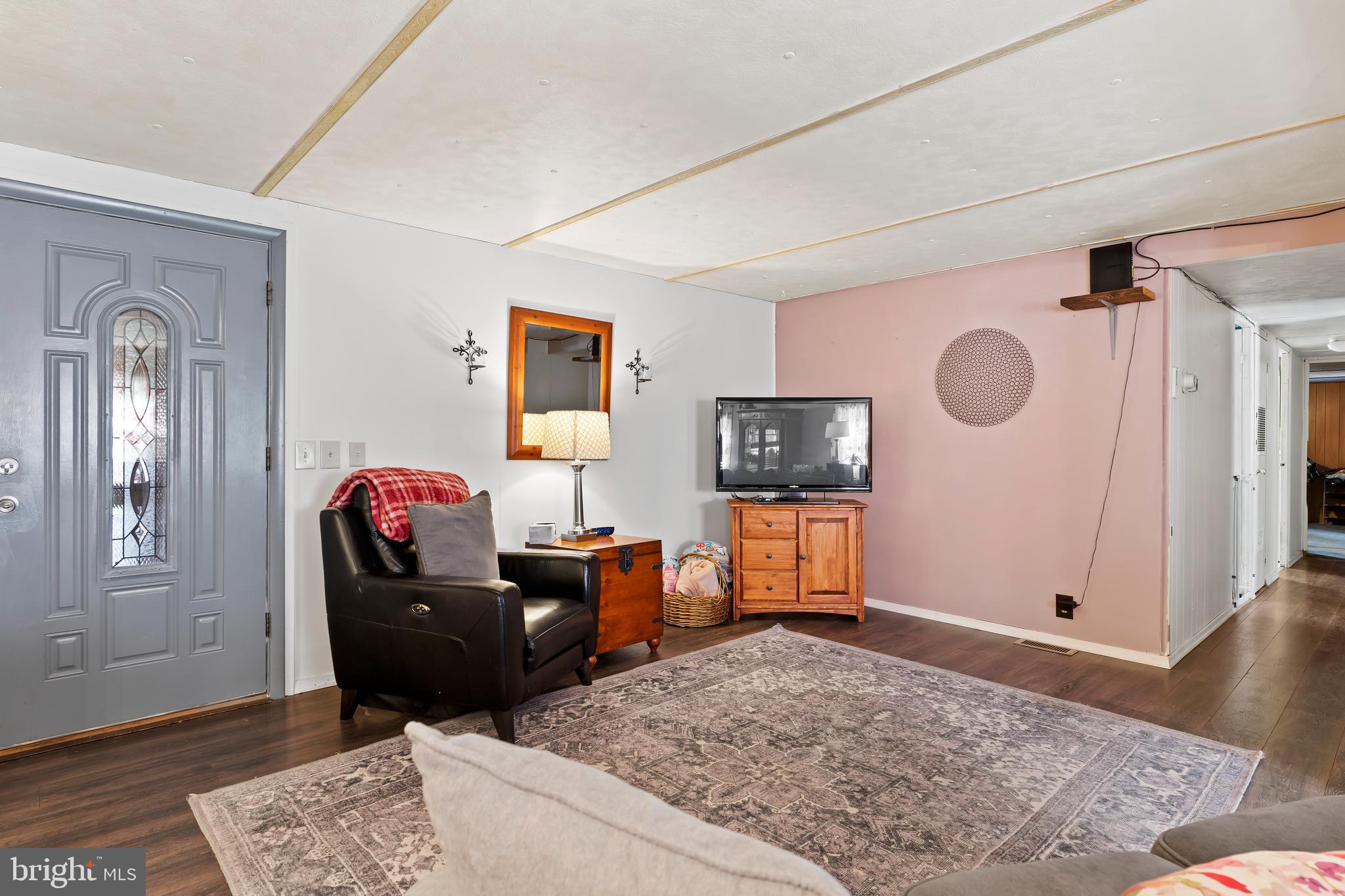 295 Greenbriar Road Elliottsburg, PA 17024 - Photo 9 of 25 a living room with furniture and a flat screen tv