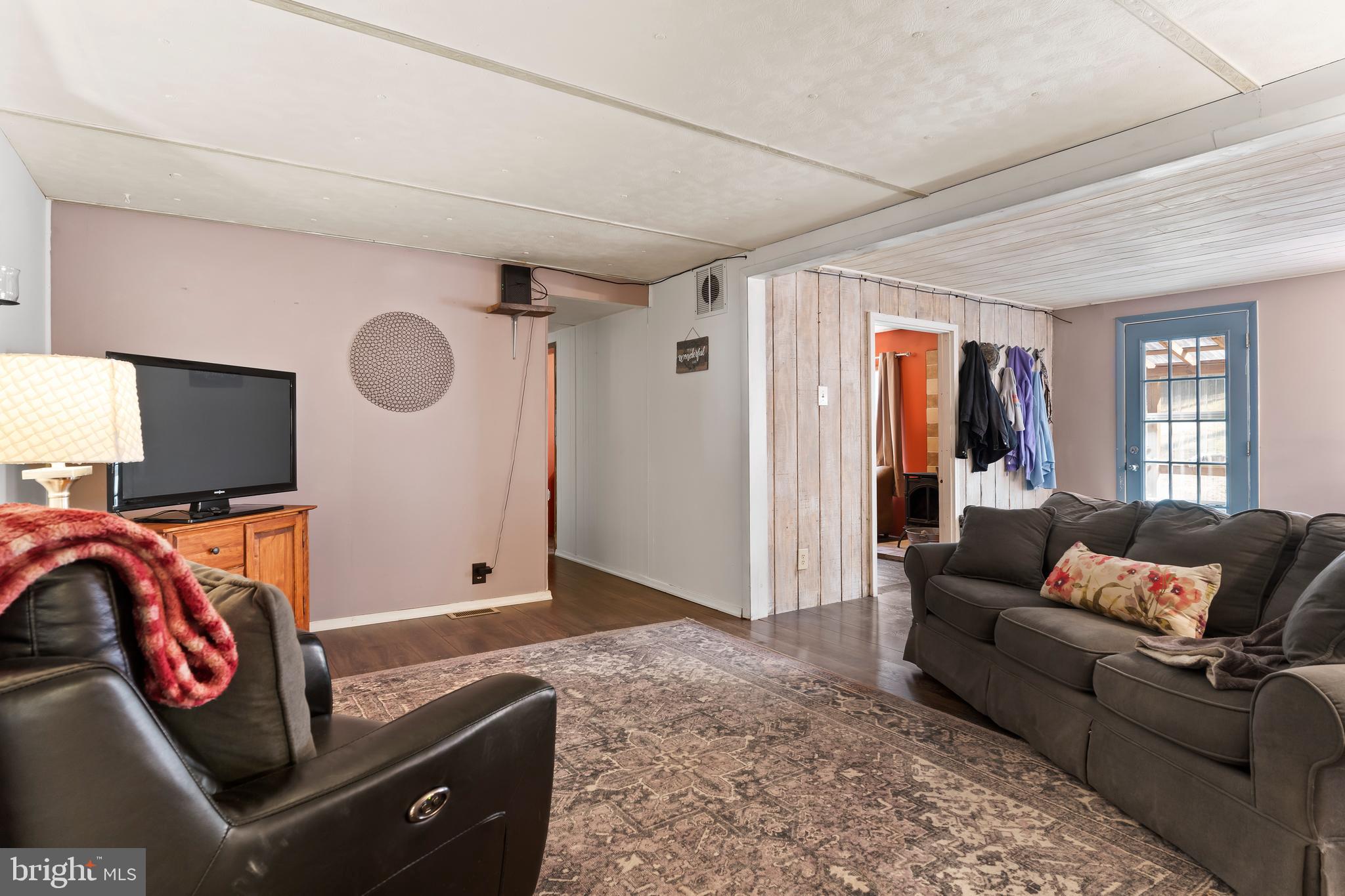 295 Greenbriar Road Elliottsburg, PA 17024 - Photo 10 of 25 a living room with furniture and a flat screen tv