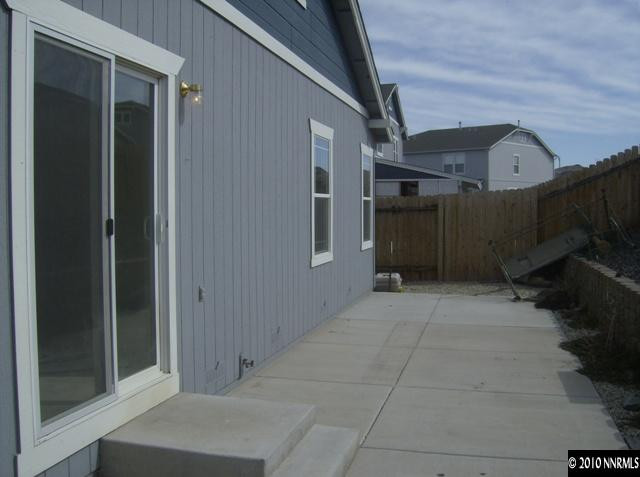 7670 Appenzell Street Reno, NV 89506 - Photo 4 of 4 a view of a car garage door and outdoor space