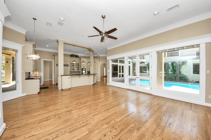 169 Grogans Point Road The Woodlands, TX 77380 - Photo 19 of 46 More unobstructed views of the courtyard pool from the kitchen/family room. French doors open to the outdoor kitchen and pool area.