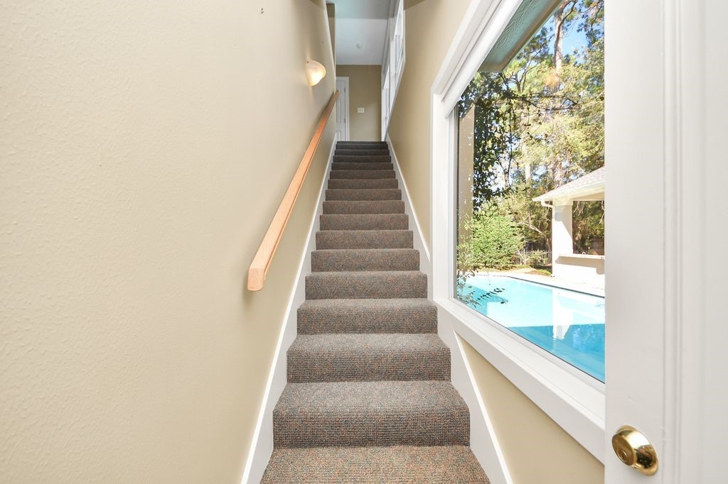 169 Grogans Point Road The Woodlands, TX 77380 - Photo 30 of 46 Off the courtyard entry, you will discover this private entrance up to the guest suite.