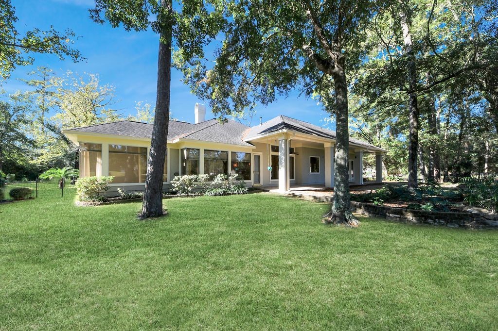 169 Grogans Point Road The Woodlands, TX 77380 - Photo 40 of 46 The rear of the home highlighting the primary suite.