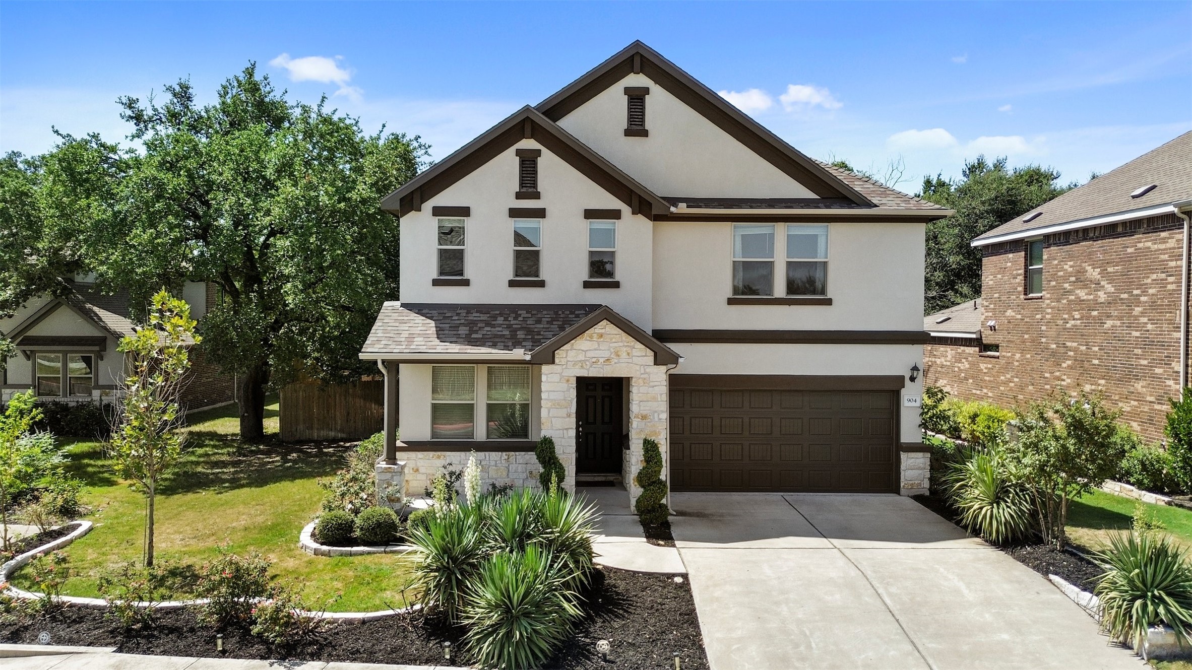 904 American Trail, Unit 2 Leander, TX 78641 - Photo 1 of 32 Front exterior and landscape on 1/3 of an acre.