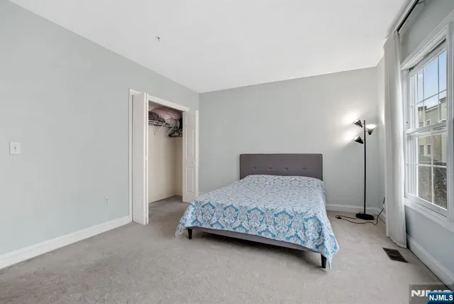 a bedroom with a bed and a cabinets