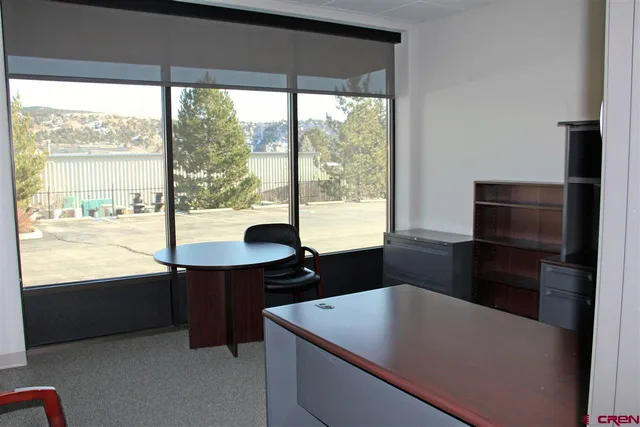 a kitchen with a large window and a table
