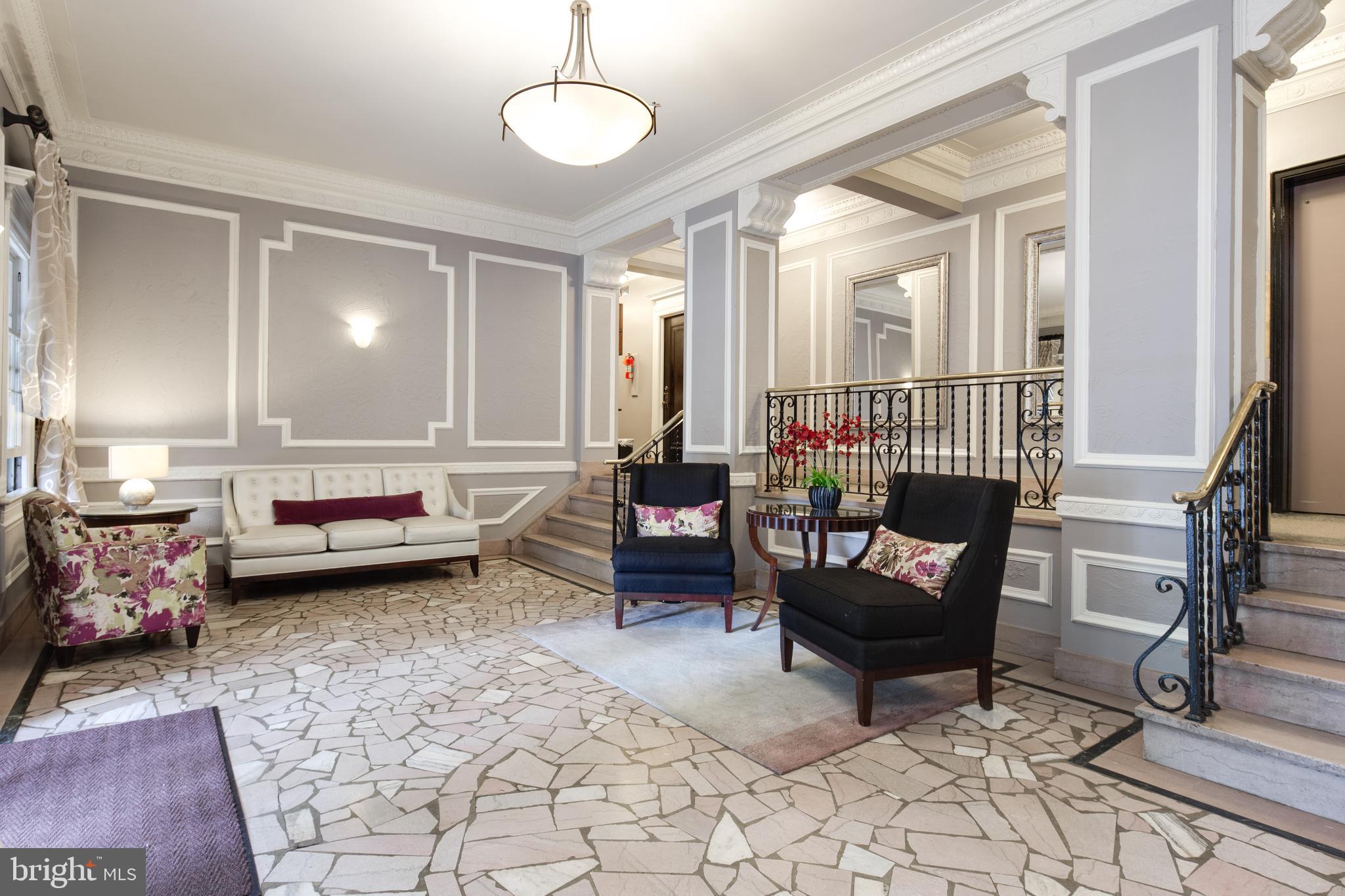 2707 Adams Mill Road Northwest, Unit 303 Washington, DC 20009 - Photo 2 of 30 a living room with furniture and a couch