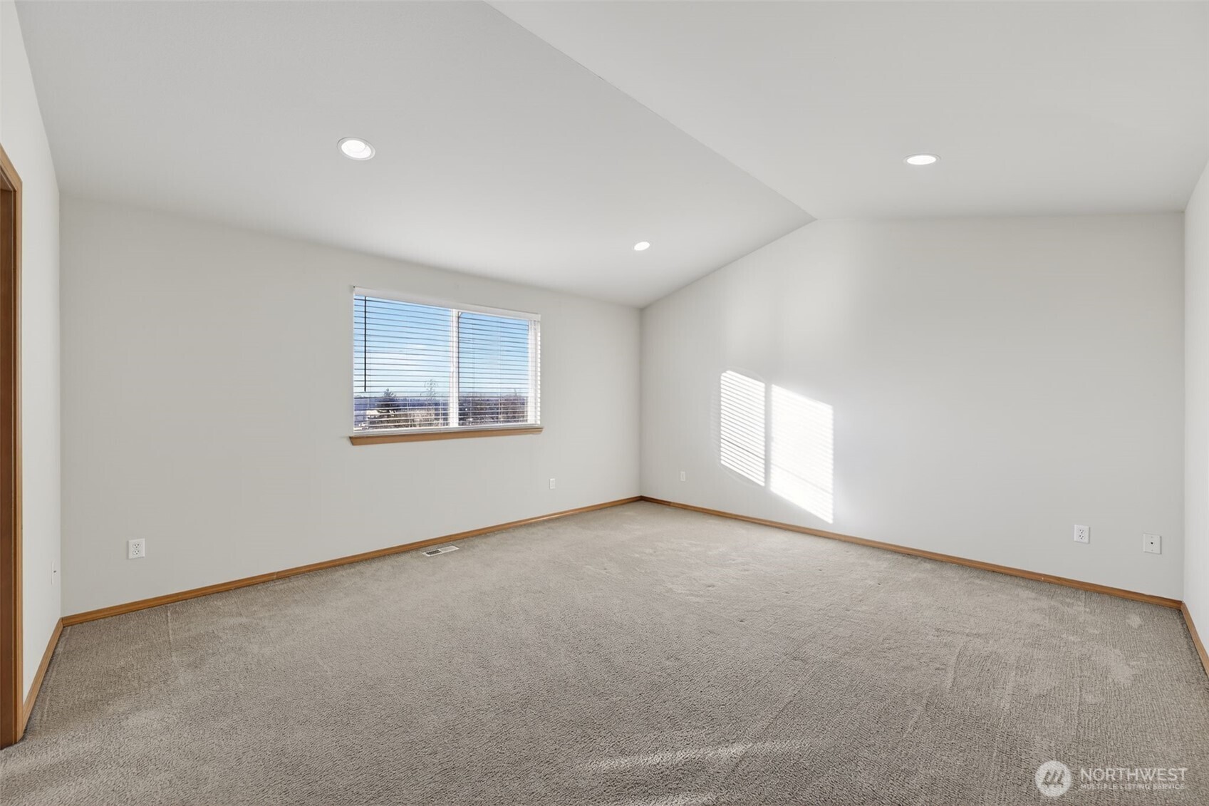 2103 Northeast 6th Circle Renton, WA 98056 - Photo 17 of 38 an empty room with a window and a projector screen