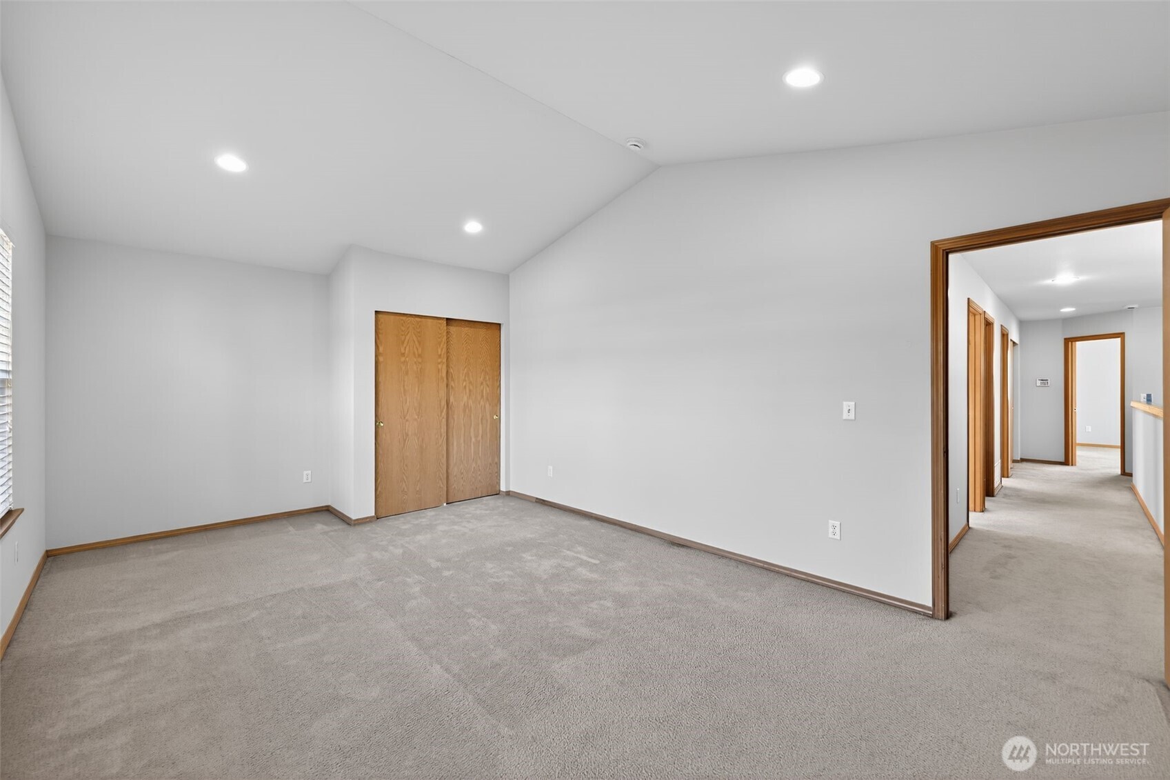 2103 Northeast 6th Circle Renton, WA 98056 - Photo 25 of 38 an empty room with closet and windows