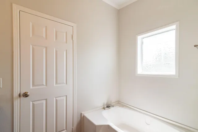a bathroom with a sink and a window