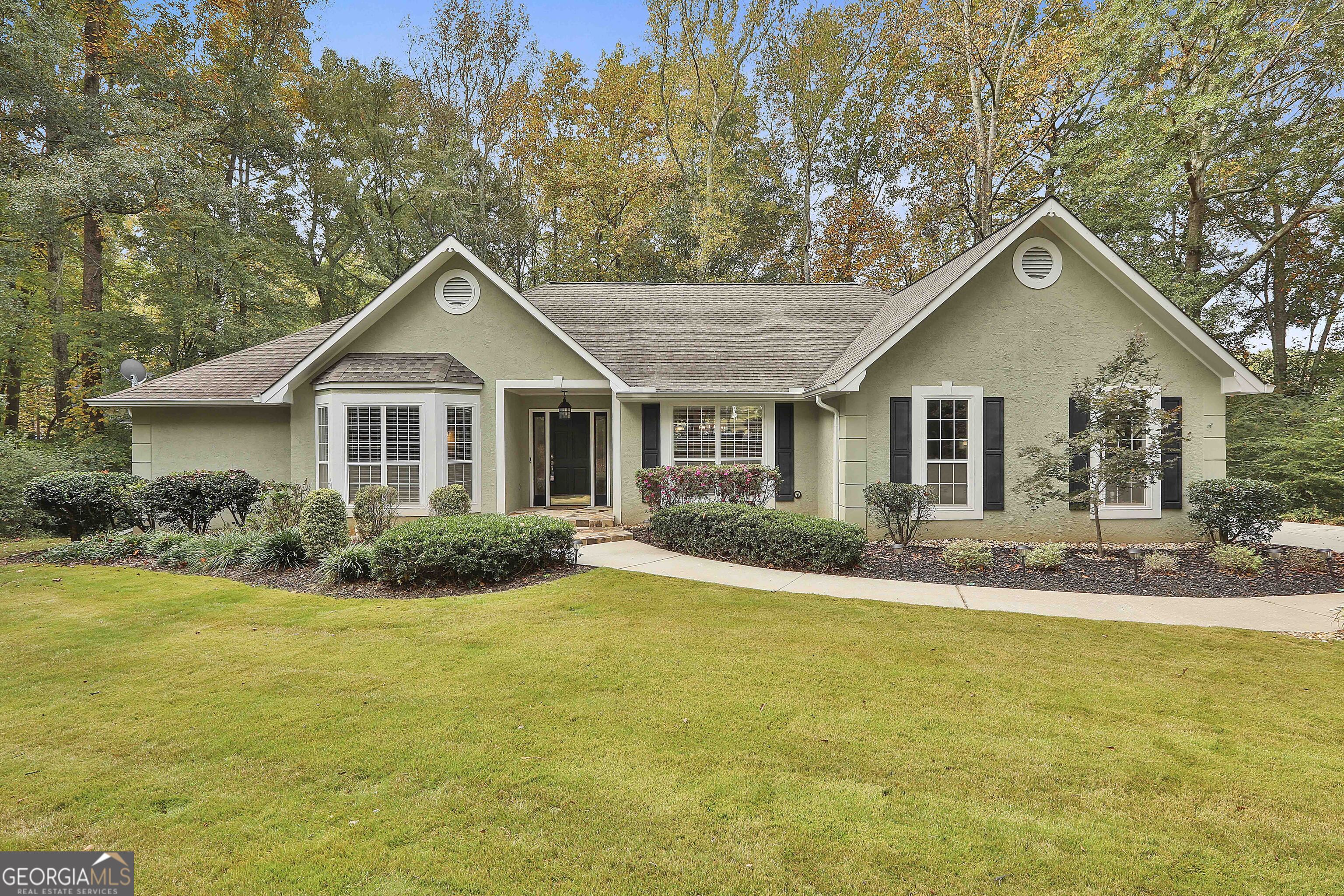a view of a house with swimming pool and porch