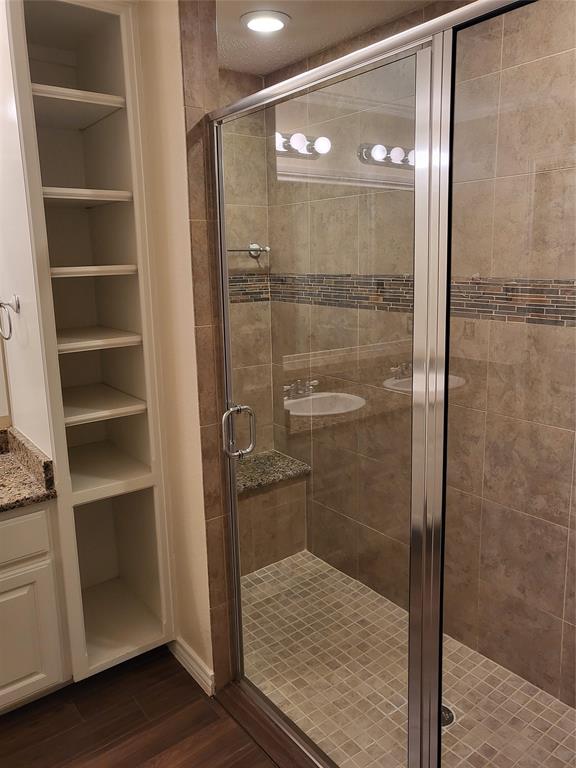 2010 Cloisters Drive, Unit 2311 Arlington, TX 76011 - Photo 12 of 24 a bathroom with a glass shower door