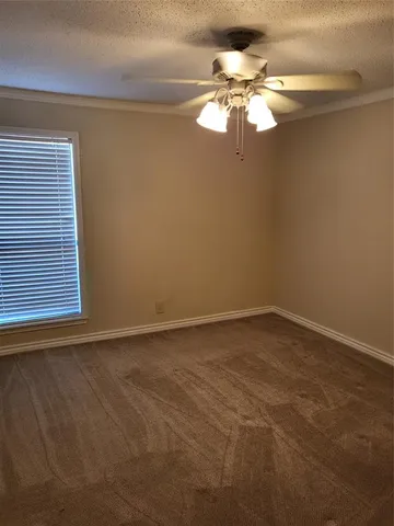 a view of a chandelier fan in a room
