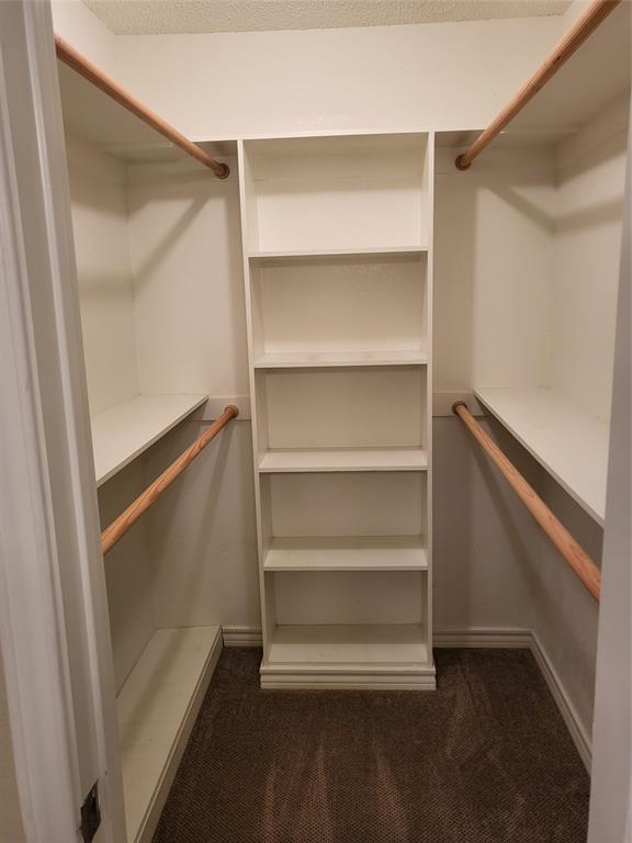 2010 Cloisters Drive, Unit 2311 Arlington, TX 76011 - Photo 20 of 24 a storage room with wooden floor