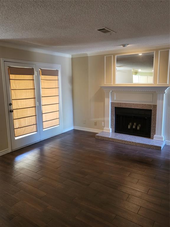 2010 Cloisters Drive, Unit 2311 Arlington, TX 76011 - Photo 2 of 24 an empty room with wooden floor fireplace and windows