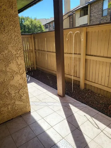 a view of a brick house with a yard