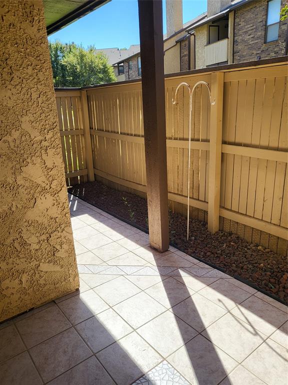 2010 Cloisters Drive, Unit 2311 Arlington, TX 76011 - Photo 22 of 24 a view of a brick house with a yard