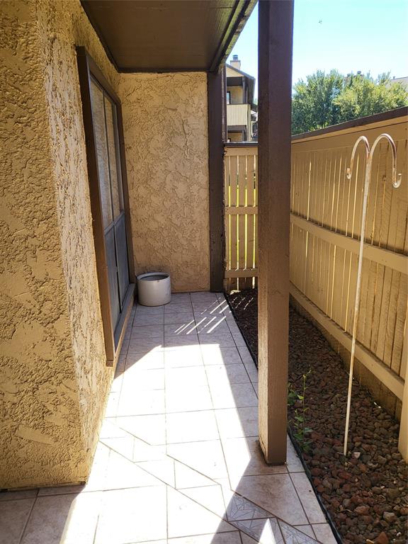 2010 Cloisters Drive, Unit 2311 Arlington, TX 76011 - Photo 23 of 24 a view of a door and wooden floor