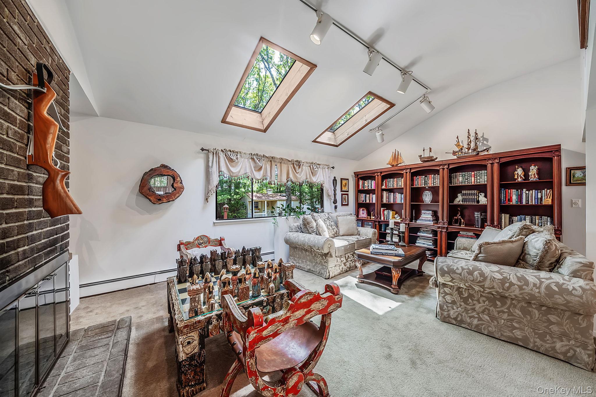 96 Fulton Boulevard Commack, NY 11725 - Photo 13 of 41 a living room with furniture and a large window
