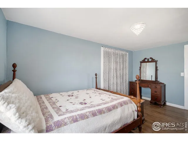 a bedroom with a bed and a table in it