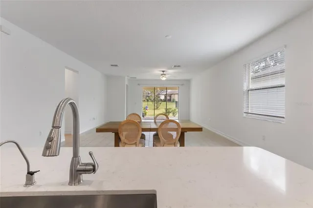 a view of kitchen island with stainless steel appliances