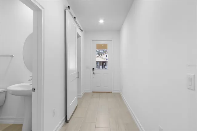 a view of a hallway with toilet