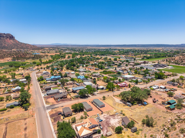464 Jessop Avenue Hildale, UT 84784 - Photo 70 of 73 Aerial perspective showcasing a residential area with varied home styles and mature trees
