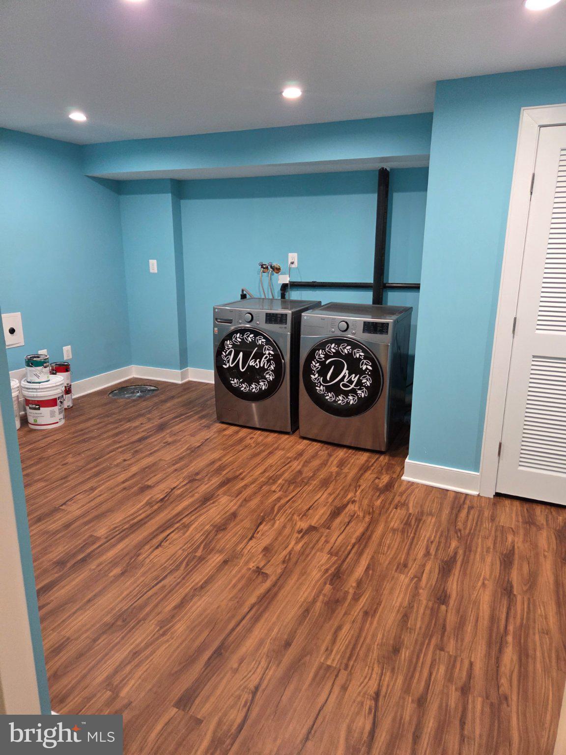 7229 Olde Lantern Way Springfield, VA 22152 - Photo 22 of 32 Bright laundry room with modern appliances.