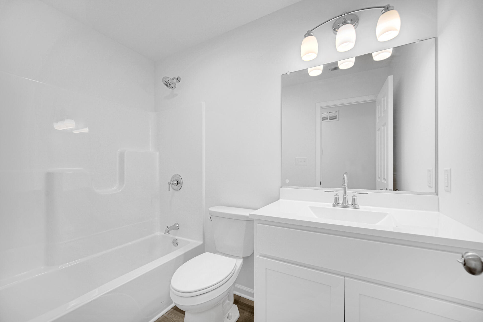 301 Malvern Road Kingsford Heights, IN 46346 - Photo 11 of 13 a bathroom with a sink a toilet and a large mirror