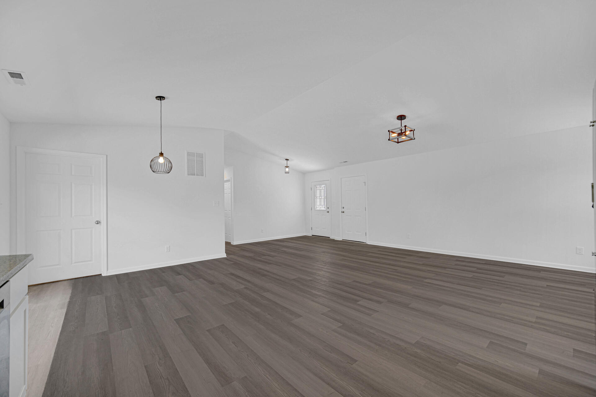301 Malvern Road Kingsford Heights, IN 46346 - Photo 9 of 13 a view of an empty room with wooden floor