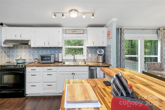 a kitchen with a refrigerator and a stove