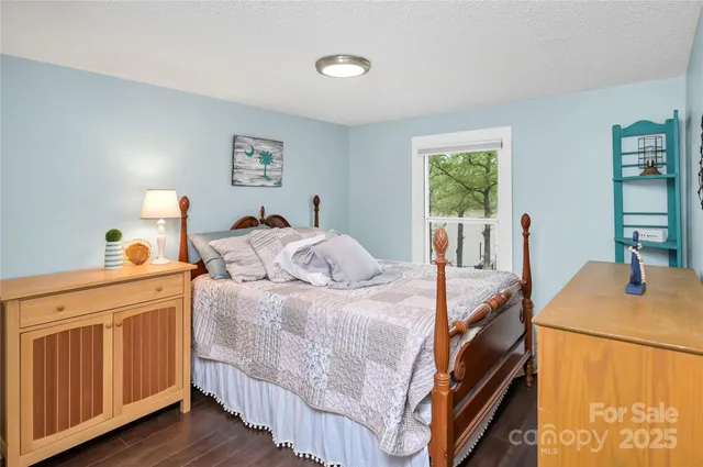 a bathroom with a sink mirror vanity and toilet