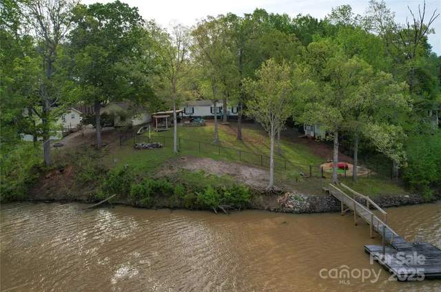a view of a lake with a house in the background