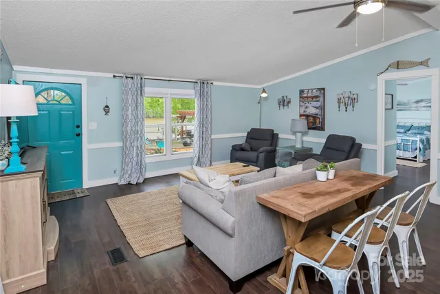 a dining room with furniture a window and wooden floor