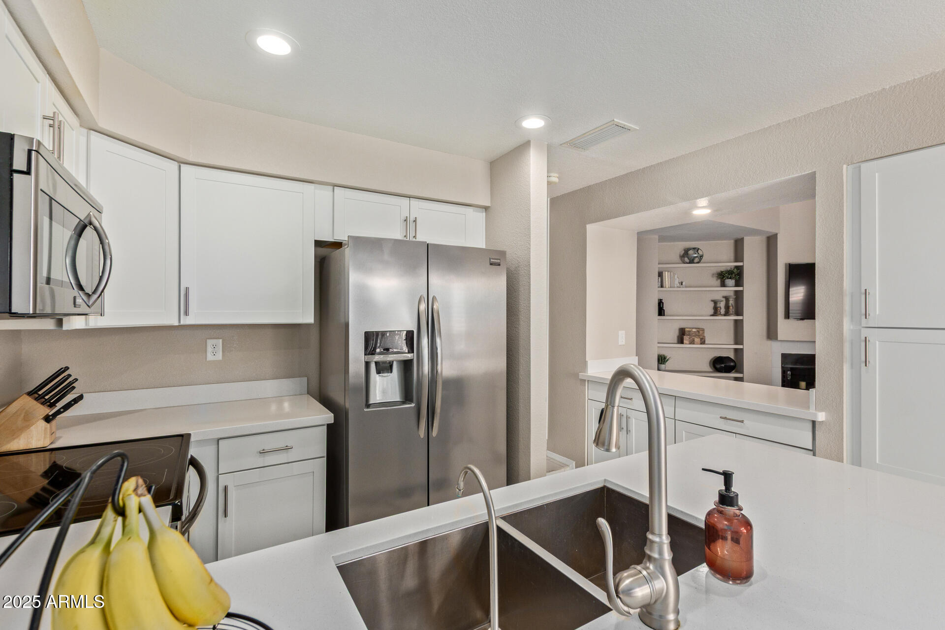 7716 South Rita Lane Tempe, AZ 85284 - Photo 13 of 31 a kitchen with a refrigerator and a sink