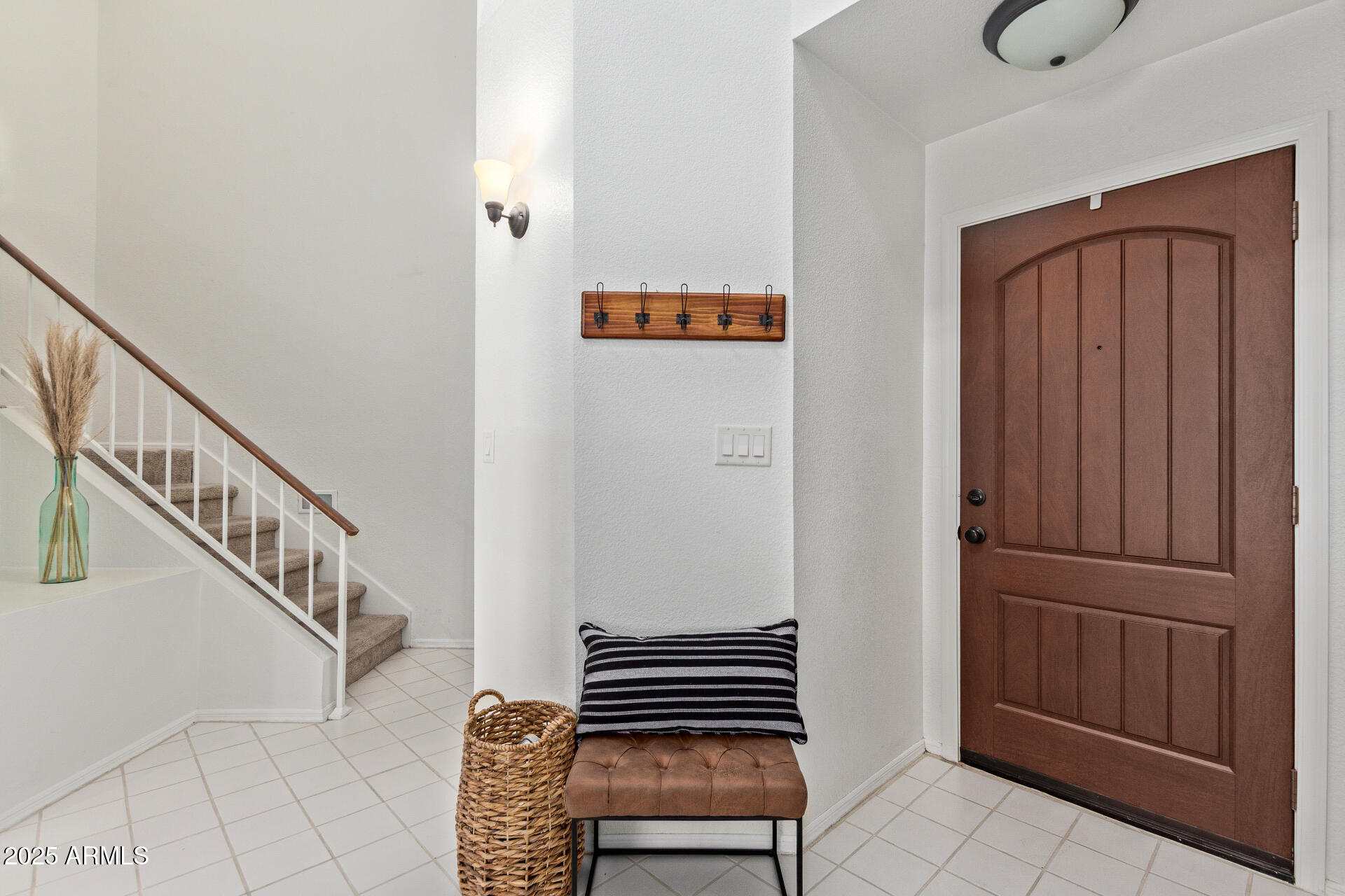 7716 South Rita Lane Tempe, AZ 85284 - Photo 6 of 31 a view of room with stairs and wooden floor