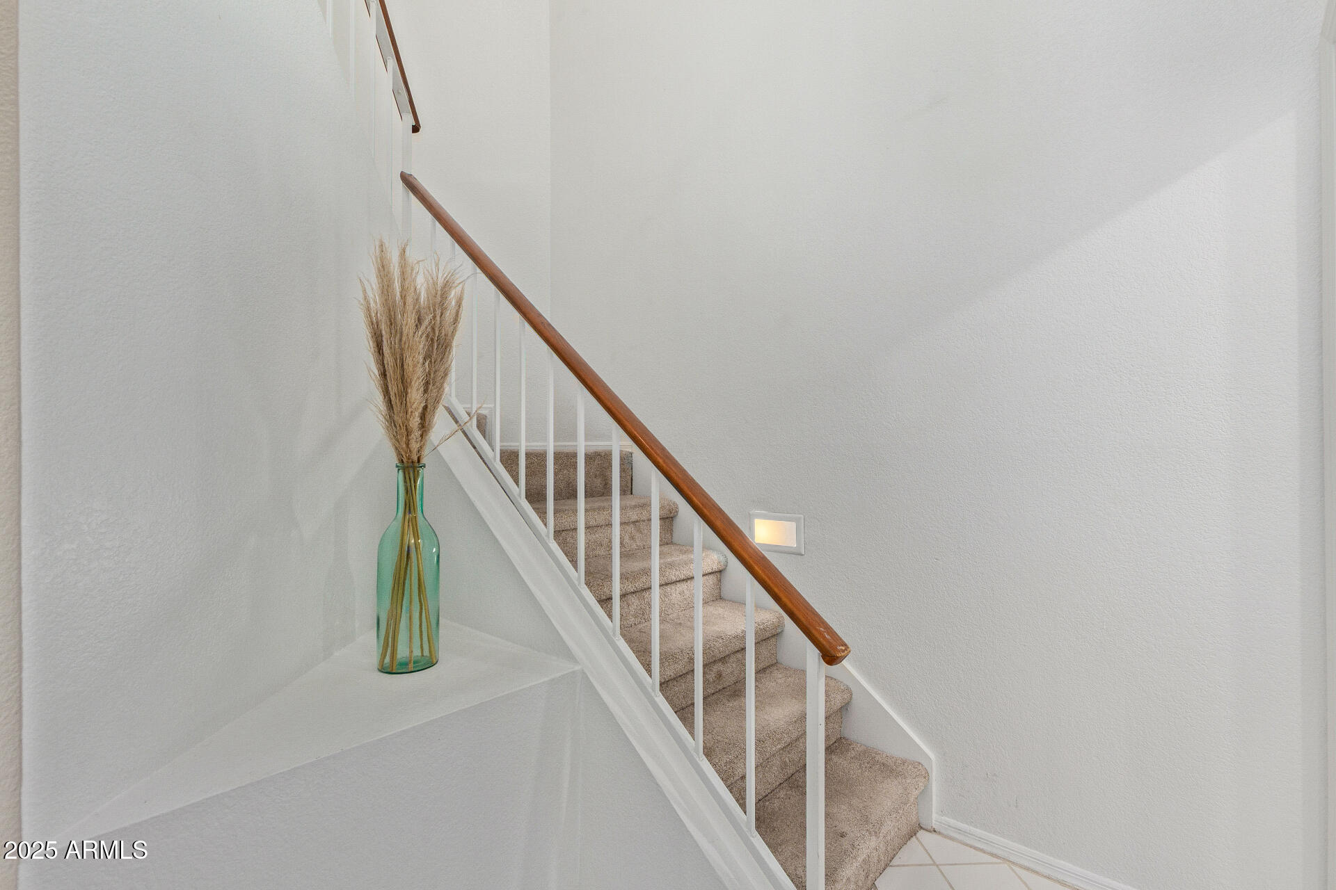 7716 South Rita Lane Tempe, AZ 85284 - Photo 7 of 31 a view of staircase with railing and white walls