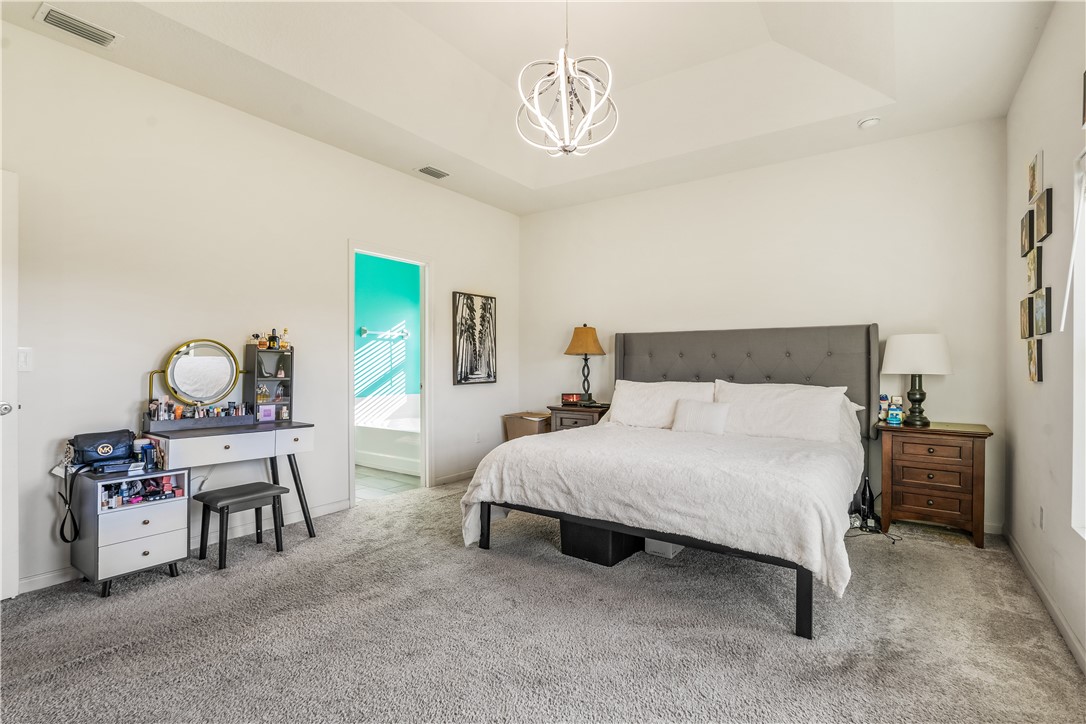 5760 1st Road Vero Beach, FL 32968 - Photo 20 of 36 a bedroom with a bed a table and chair