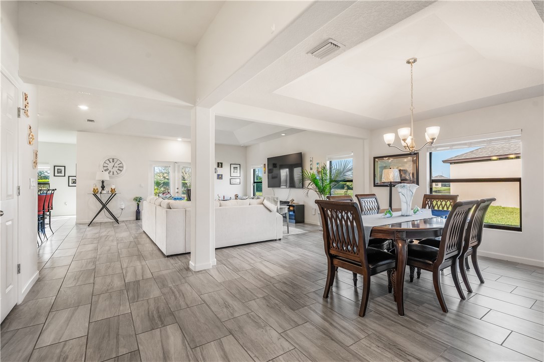5760 1st Road Vero Beach, FL 32968 - Photo 2 of 36 a view of a dining room with furniture window and wooden floor